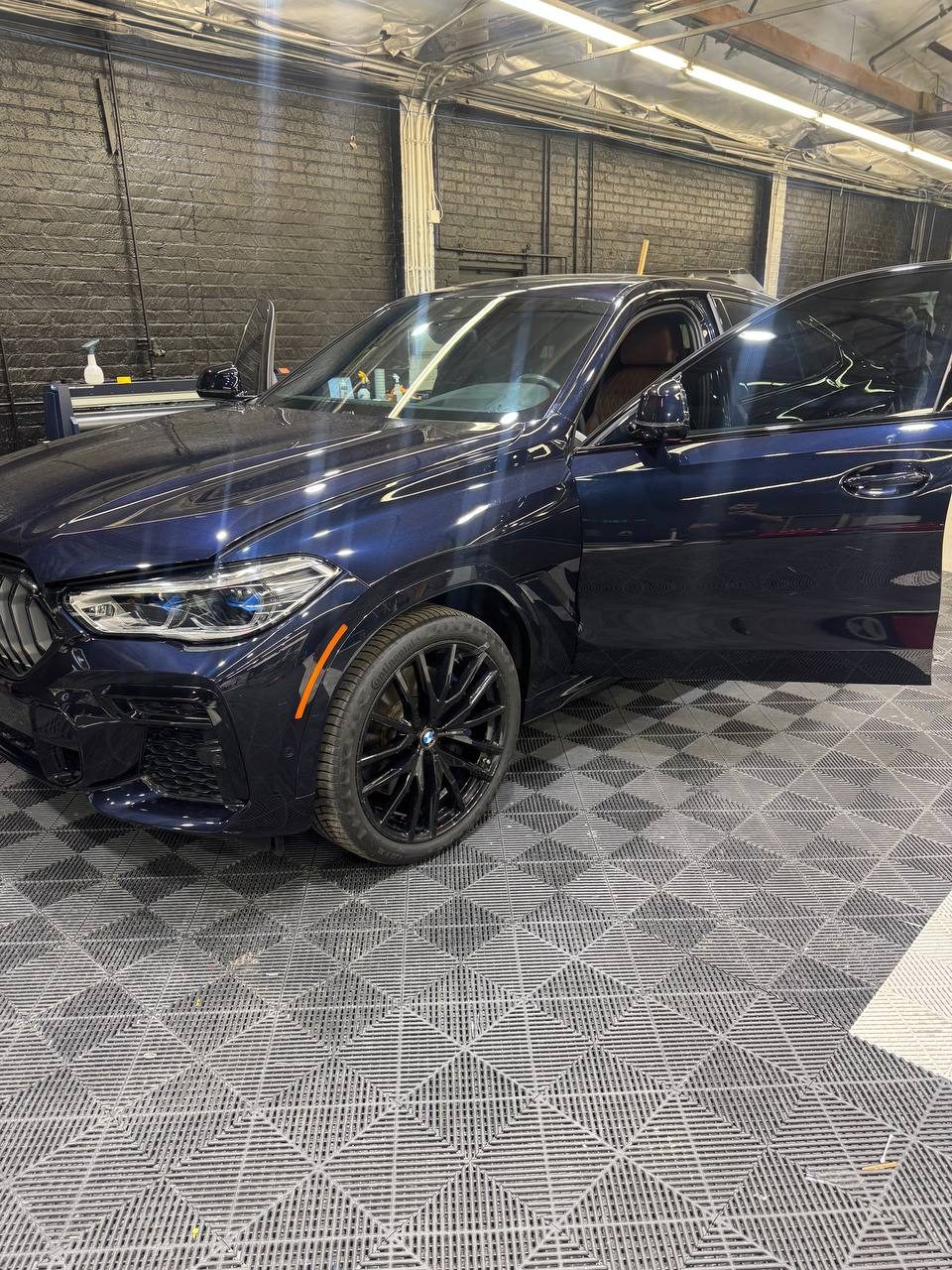 Dark blue BMW X6 with tinted windows