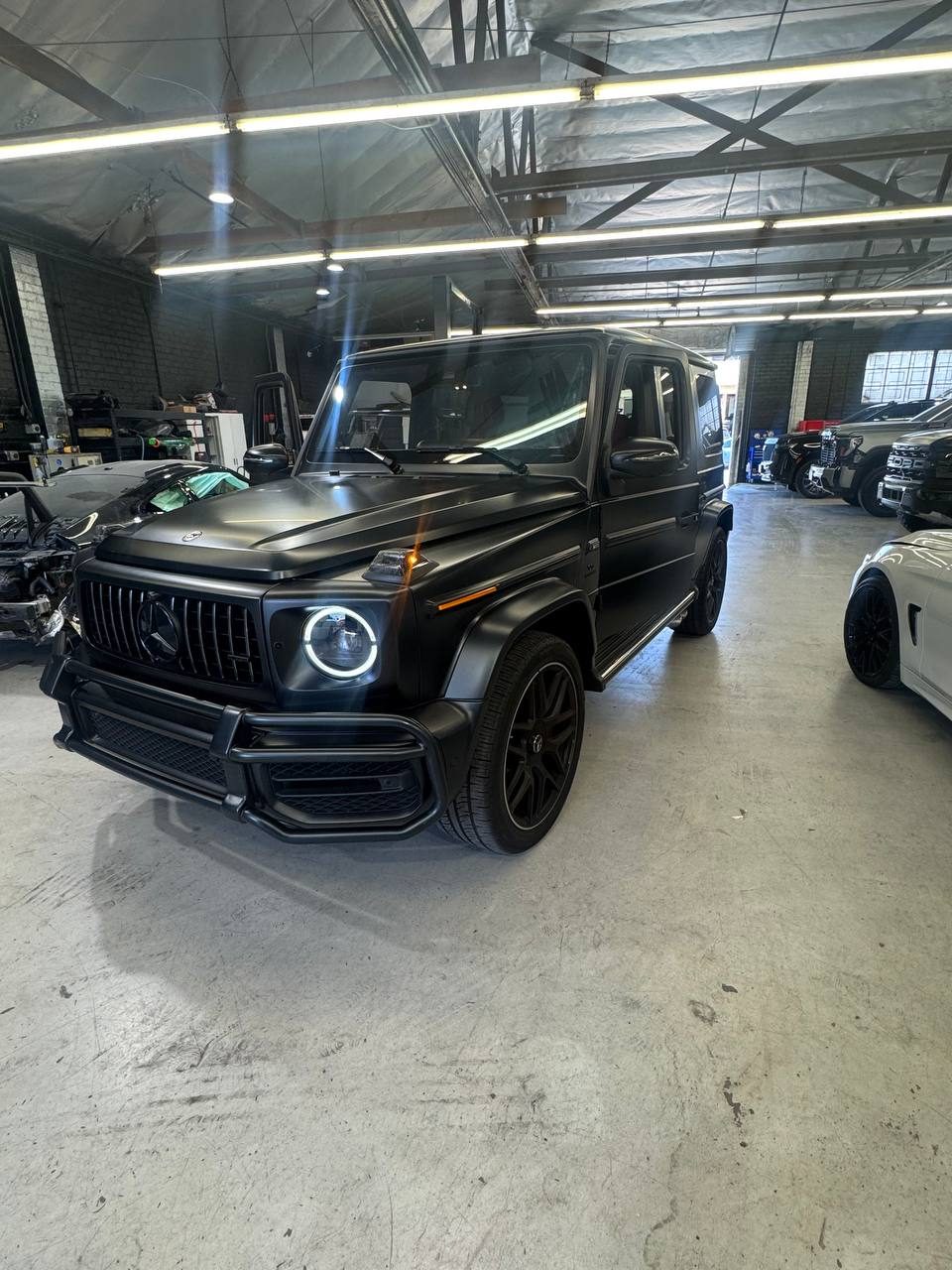Matte black Mercedes-AMG G63 with dark ceramic tint