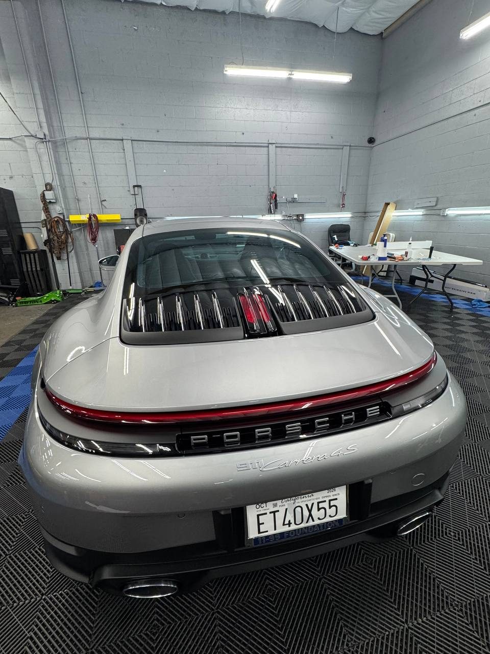 Silver Porsche 911 Carrera 4S with tinted rear glass